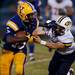 Ypsilanti senior running back Tyree Weatherspoon stiff arms on Friday. Daniel Brenner I AnnArbor.com